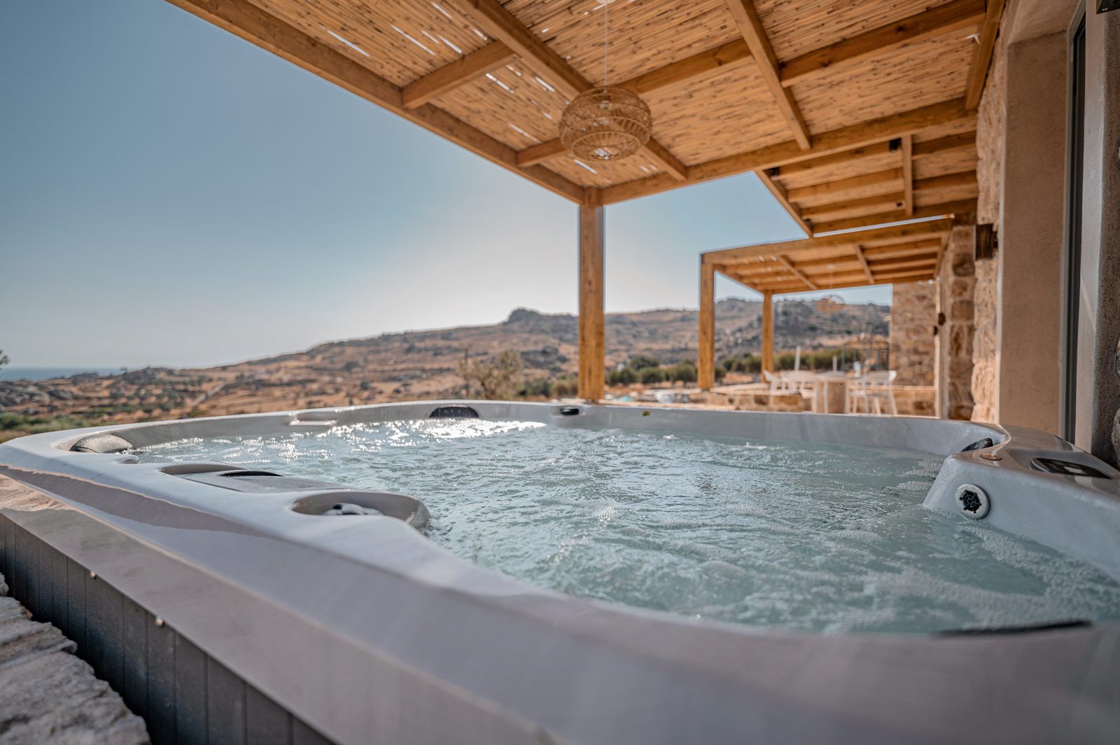 Private jacuzzi on the terrace of Villa A in Naxos overlooking the hills and the sea