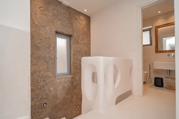 Bathroom with carved stone basin at Terra & Olive Villa in Naxos